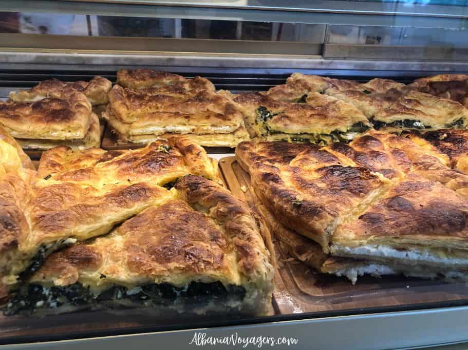 spinach and cheese burek in a shop window, maybe the best thing to eat in Tirana