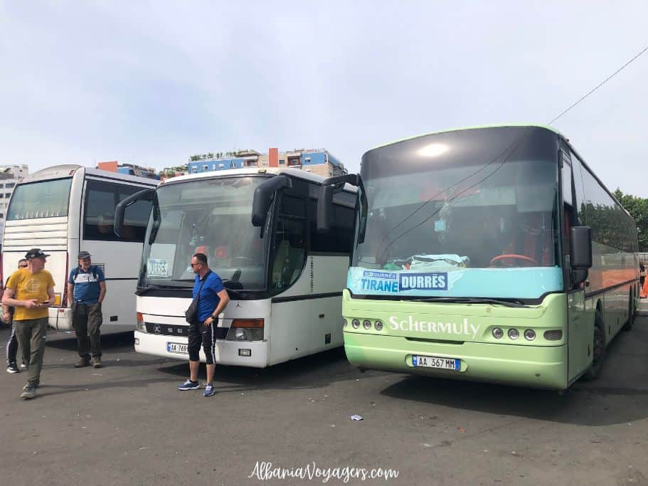 3 coaches with Durres sign and drivers in front at Tirana's South and North Bus Terminal