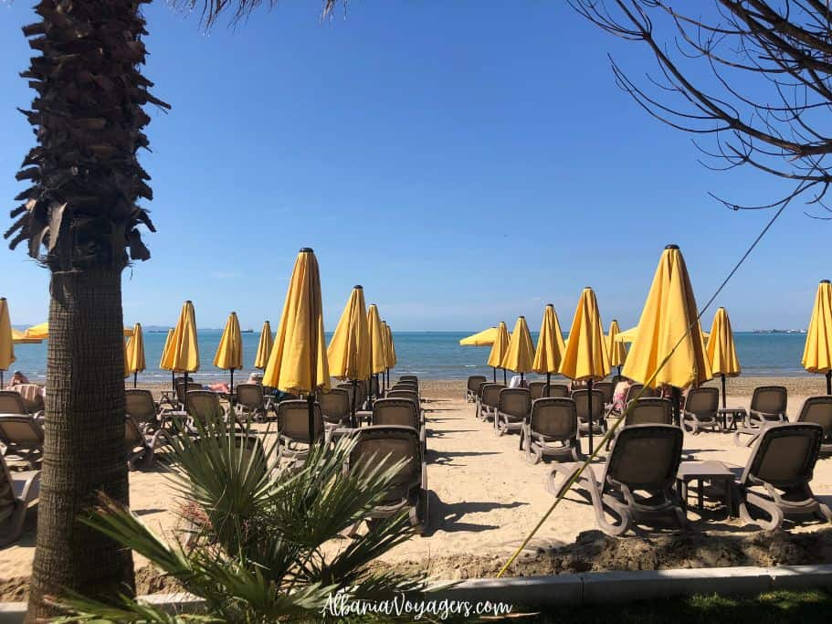 Durres Beach, Albania with loungers and yellow umbrellas