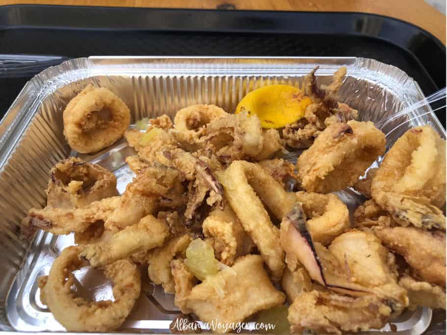 take away tray full of kalamari on a brown tray at Peshk i Fresket Bracja 2 - the best place to eat fresh seafood in Durres