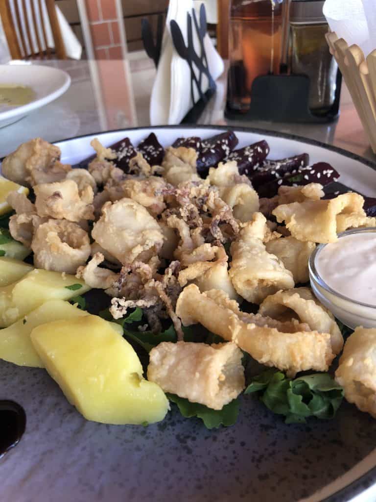 plate of fried kalamari with potatoes and beets at Taverna Ulson