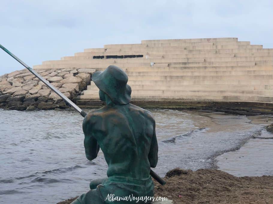 Sfinksi with scupture of fisherman in front