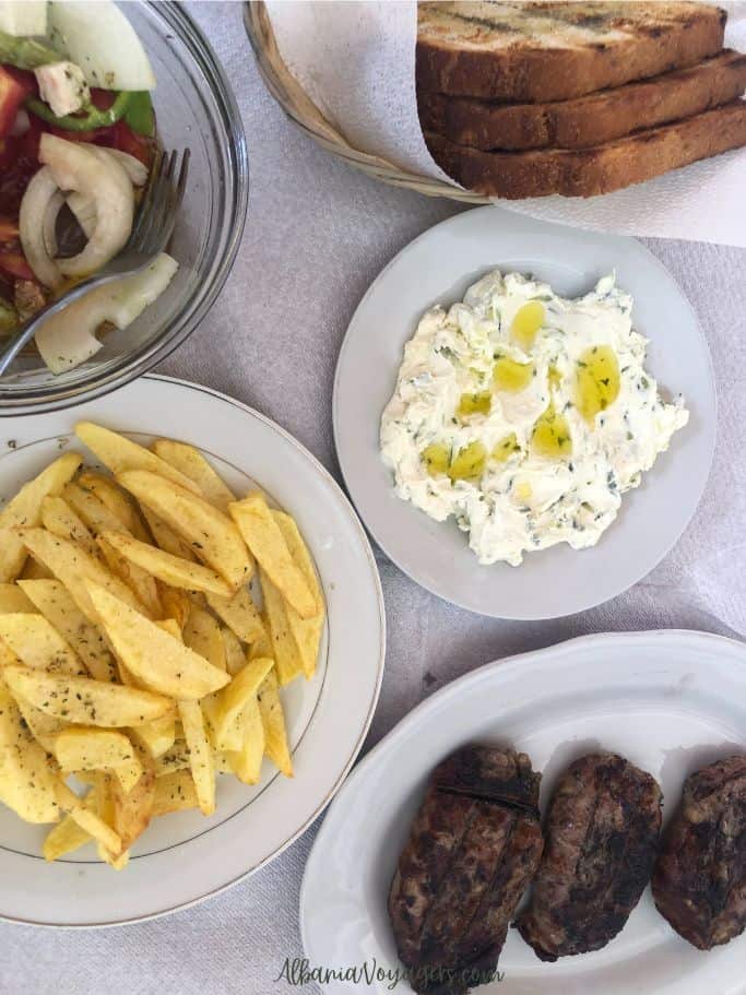 plate full of food at Bega Guesthouse Restaurant in Ksamil