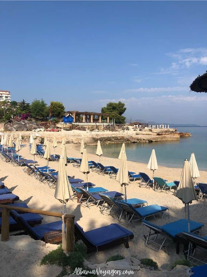 Lori Beach with sunbeds in Ksamil