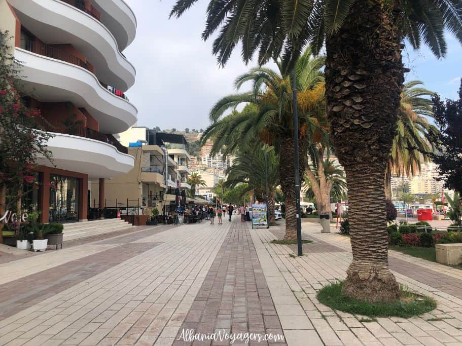 looking down Saranda's promenade past palm trees 