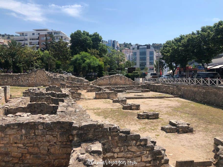 Synagogue - Basilica ruins in Saranda surrouned by trees a nd low rise buildings