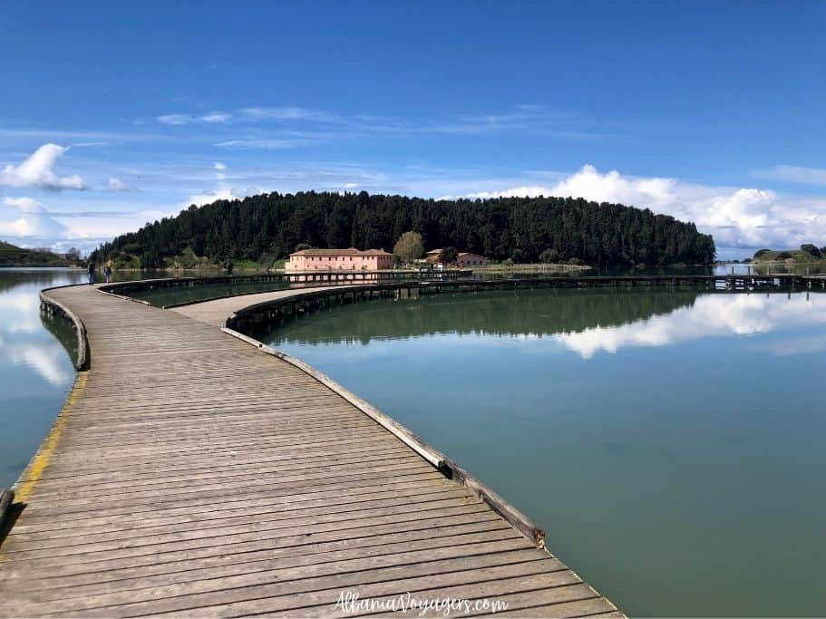 wooden curved footbridge over lagoon to Zvernec Island