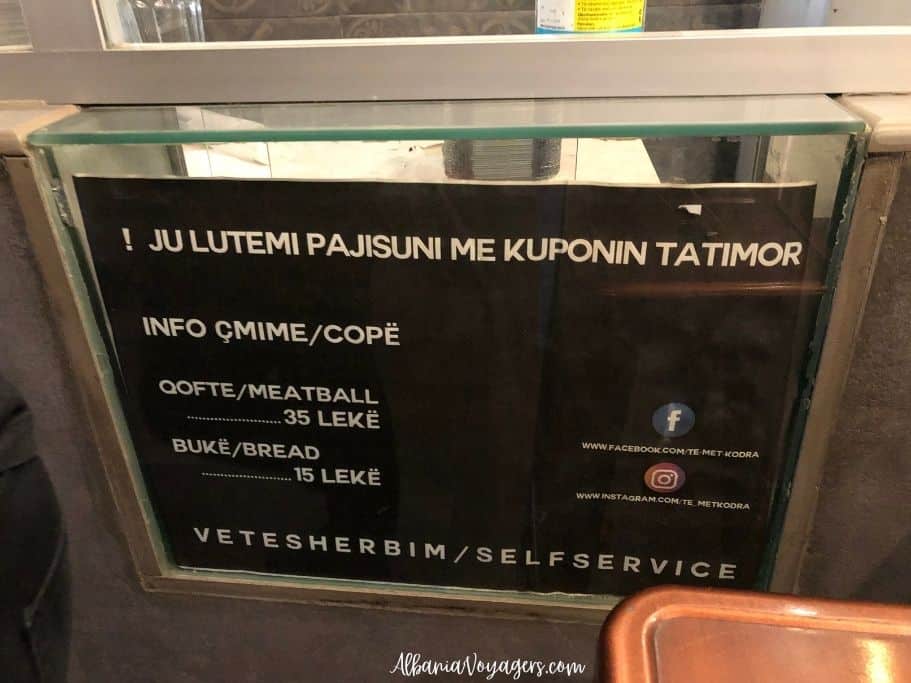 sign with prices for qofte and breat at Te Met Kodra in Tirana