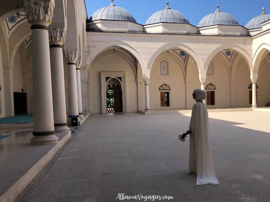 a bride in white in the courtyard of Namazgah Mosque in Tirana