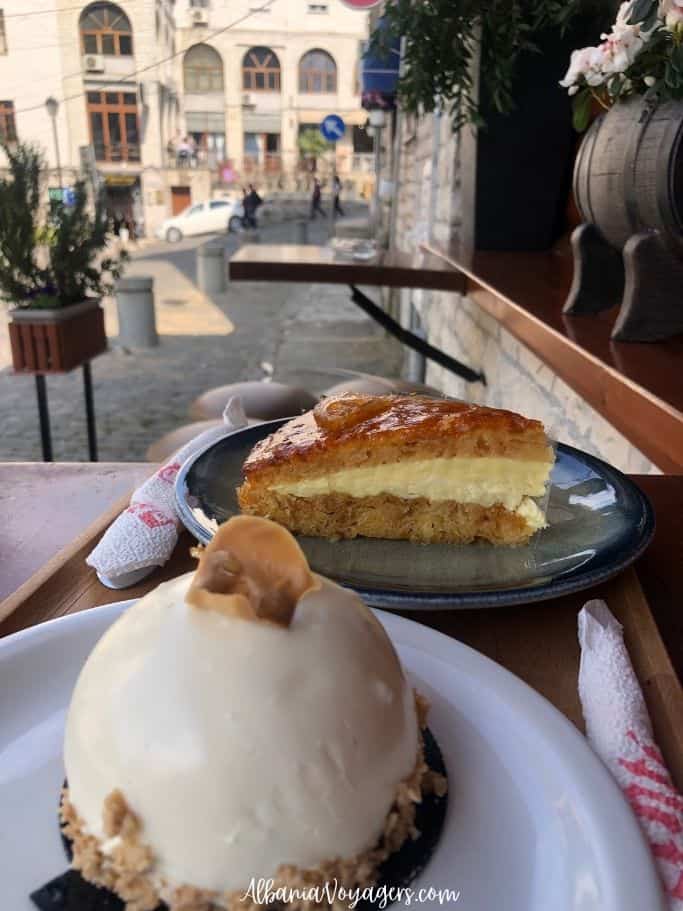 two plates of pastry on outdoor table at Antigonea 2000 in Gjirokaster