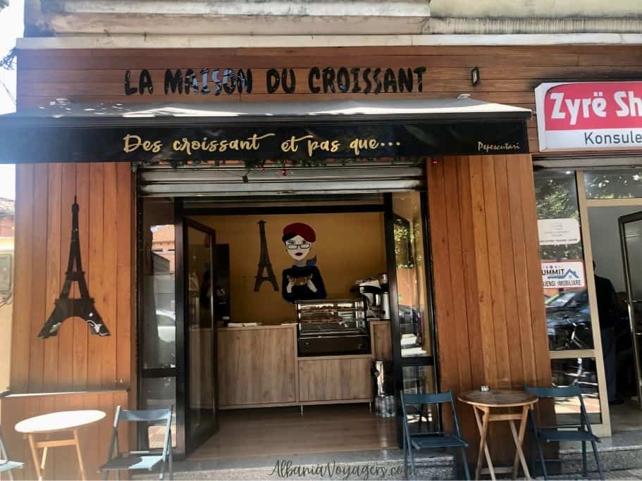 exterior of La Masion du Croissant with small tables out front in Shkoder