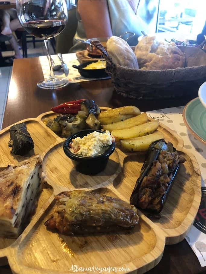 wooden round platter with assorted meze at Fisi Restaurant in Shkoder
