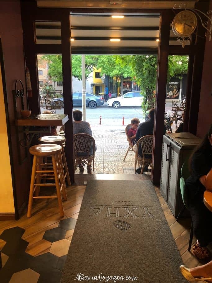interior of YXHA Coffee looking out ont othe street in Shkoder
