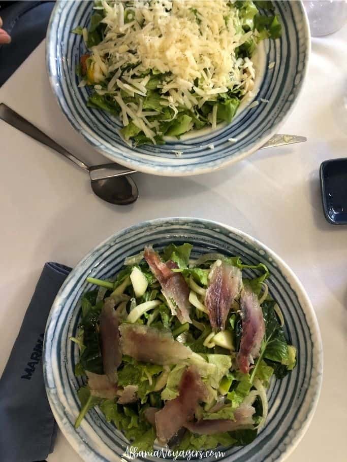 two big blue and white bowls with salada at Marina Seafood Restaurant in Shkoder, one of the best places to eat
