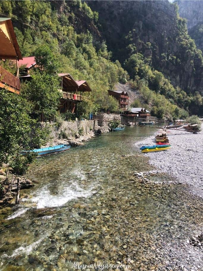 long view of Shala River with guesthouses and kayaks