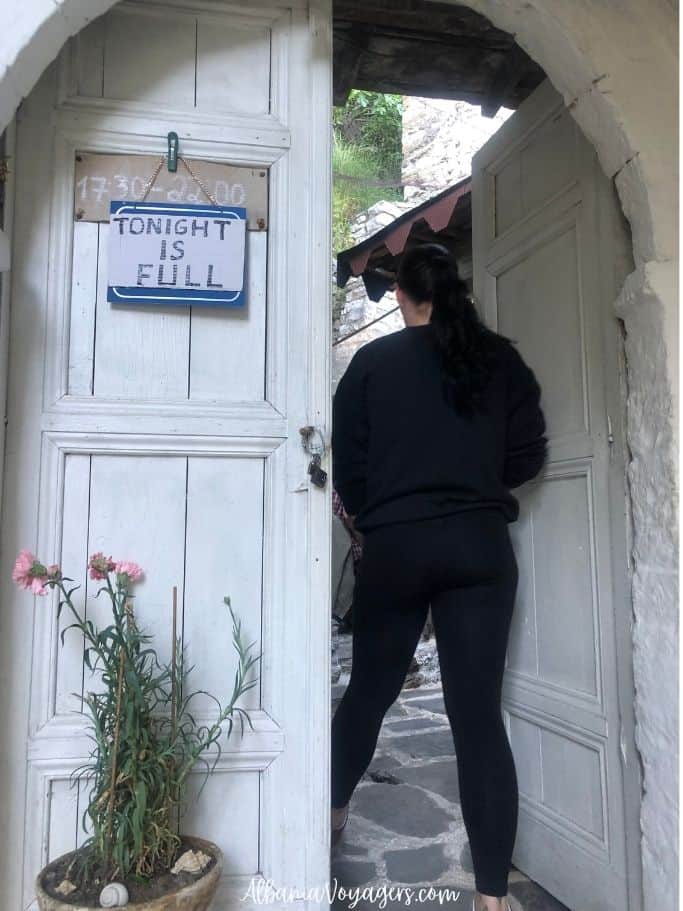 big white door with 'tonight is full' sign at Homemade Food Lili