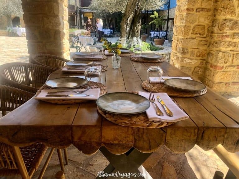 outdoor fancy wooden picnic table set for dining at Toka, Blerina Agritourism