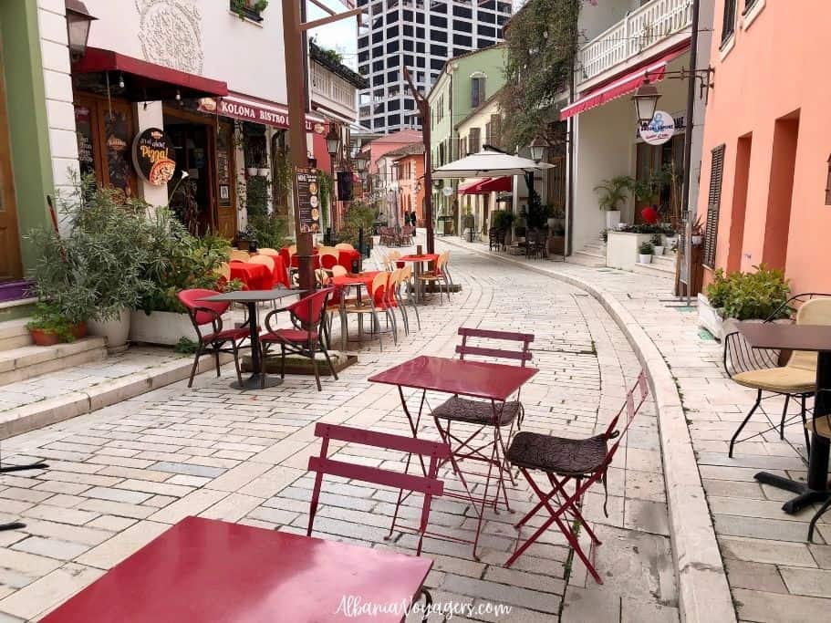 Vlore Old Town with cafe tables on cobblestone, one of the most popular things to do