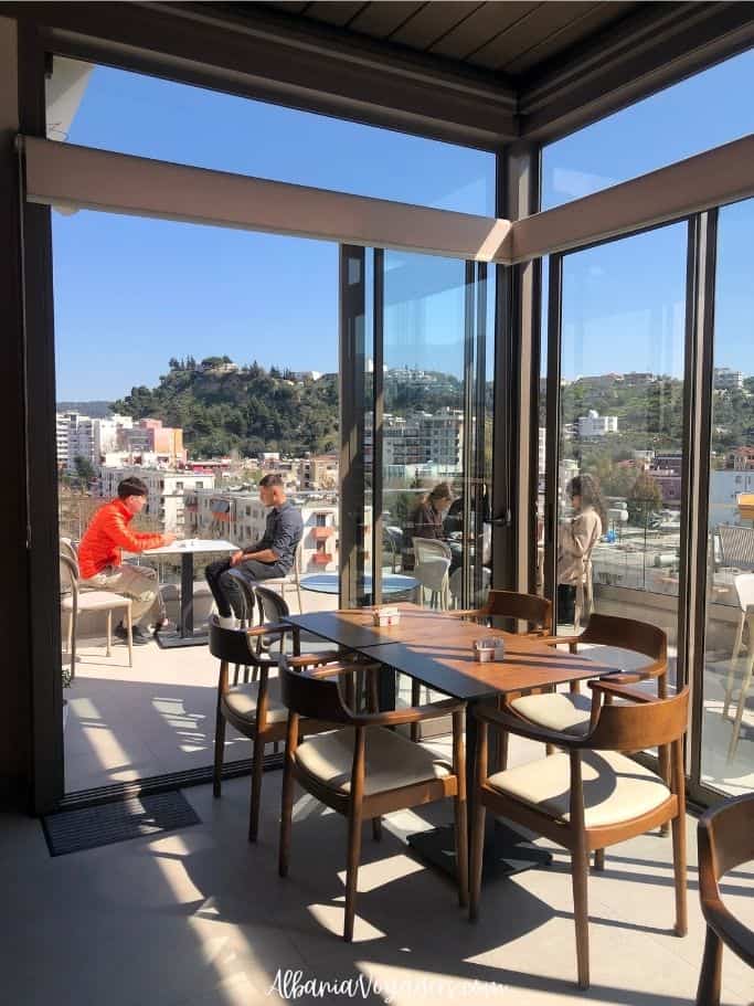 rooftop restaurant with views of hills at Sasso Hotel in Vlore