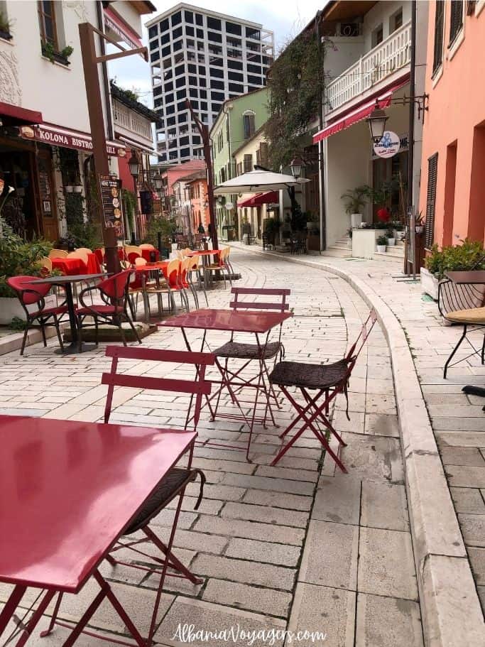 quiet street in Vlore Old Town with cafe tables
