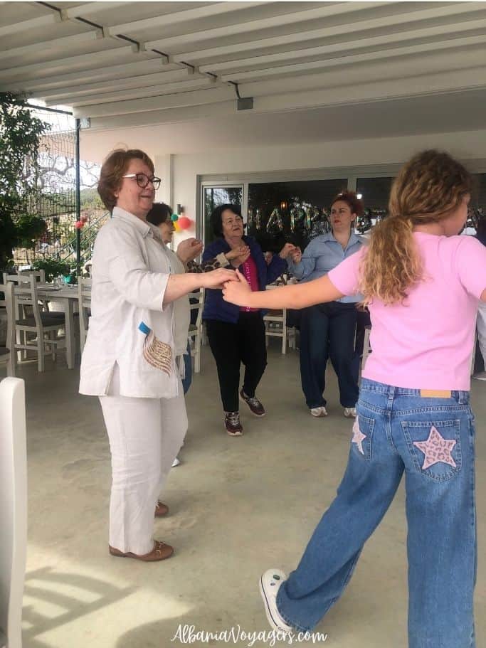 group of women doing a traditional Albanian dance at Tamo's Farm