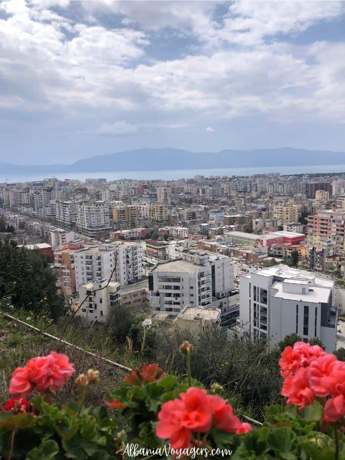 elevated views of Vlore with flowers in foreground from Kuzum Baba