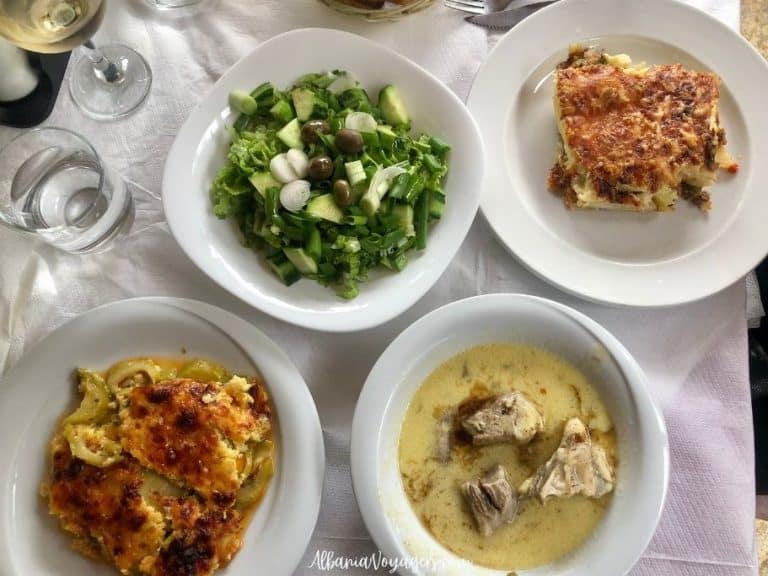plates of food on white table cloth at Te Culi in Permet