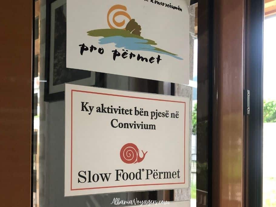 close up of Slow Food sign in restaurant door in Permet