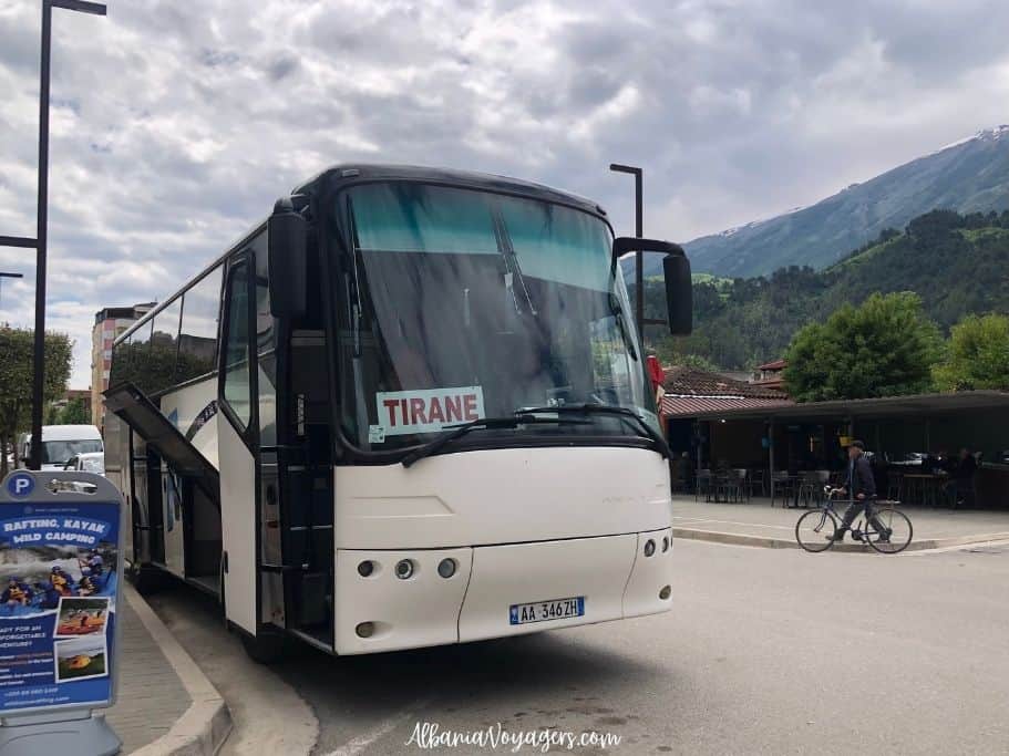 coach bus for Tirana parked on street in Permet