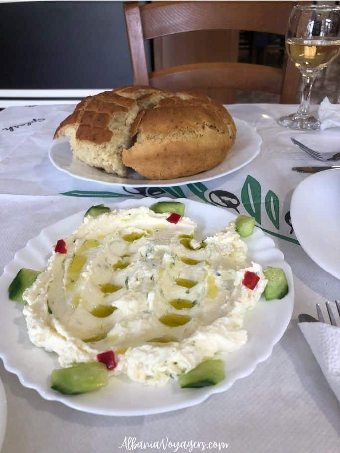 plate of tzatziki and bread on table at Restorant Aned in Permet