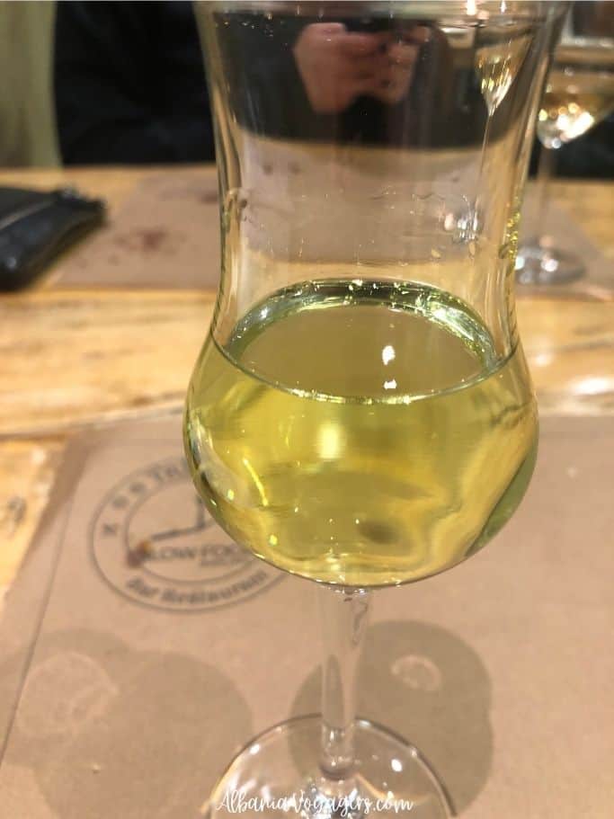 glass of mulberry raki at Trifilia in Permet