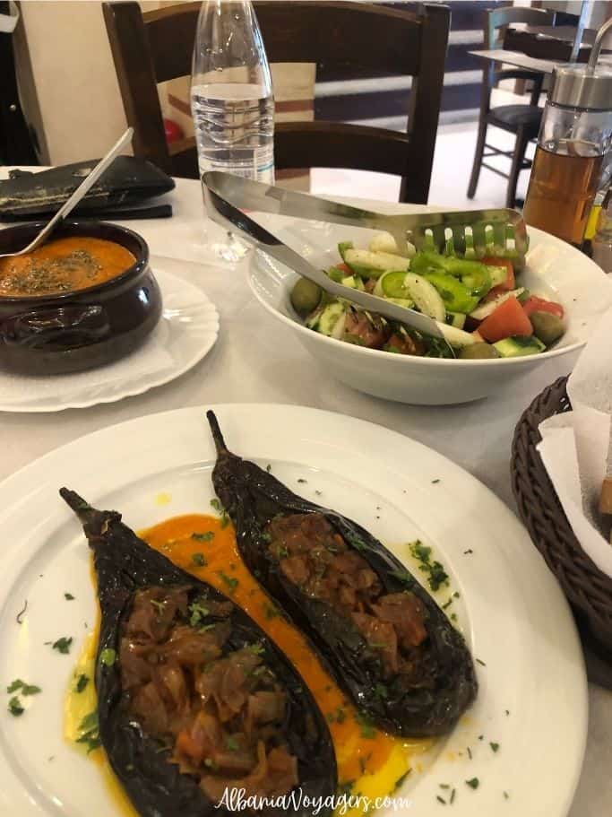 plates of stuffed eggplant, salad and meatballs in sauce at Sofra Permetare