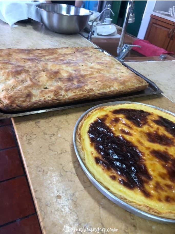 Huge byrek and lemon tart cooling on the kitchen counter at Blerina Farm