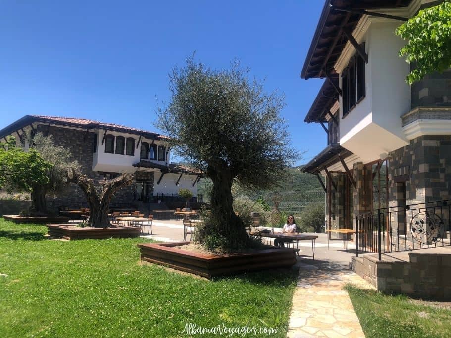 traditional stone and wood buildings of Pupa Winery one of the best stays in Albania