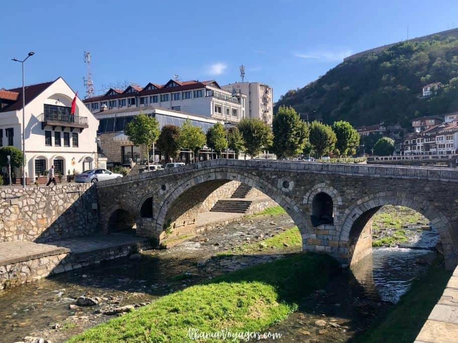view of Old Stone Bridge in Prizren, Kosove with mountains in background
